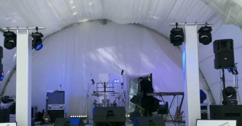 Lighting fixtures and truss elements staged for waterfront event advantages