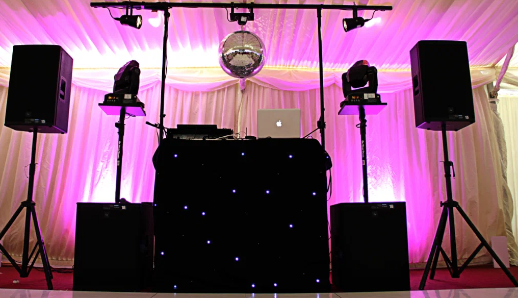 Harbor event with stage lighting and reflections on the water during a live show